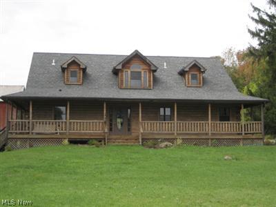 13009 Winagle Road Hiram, OH 44234 - Photo 1 of 1 Rustic Log home with full wrap around porch perched on a hill. Full walk out lower level