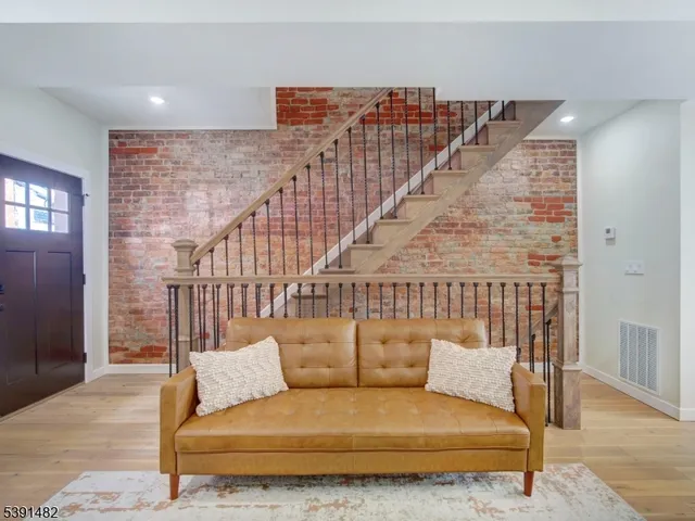 a balcony with furniture and a rug