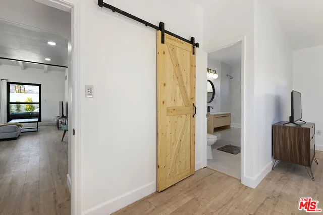 a view of a bathroom with a tub and shower