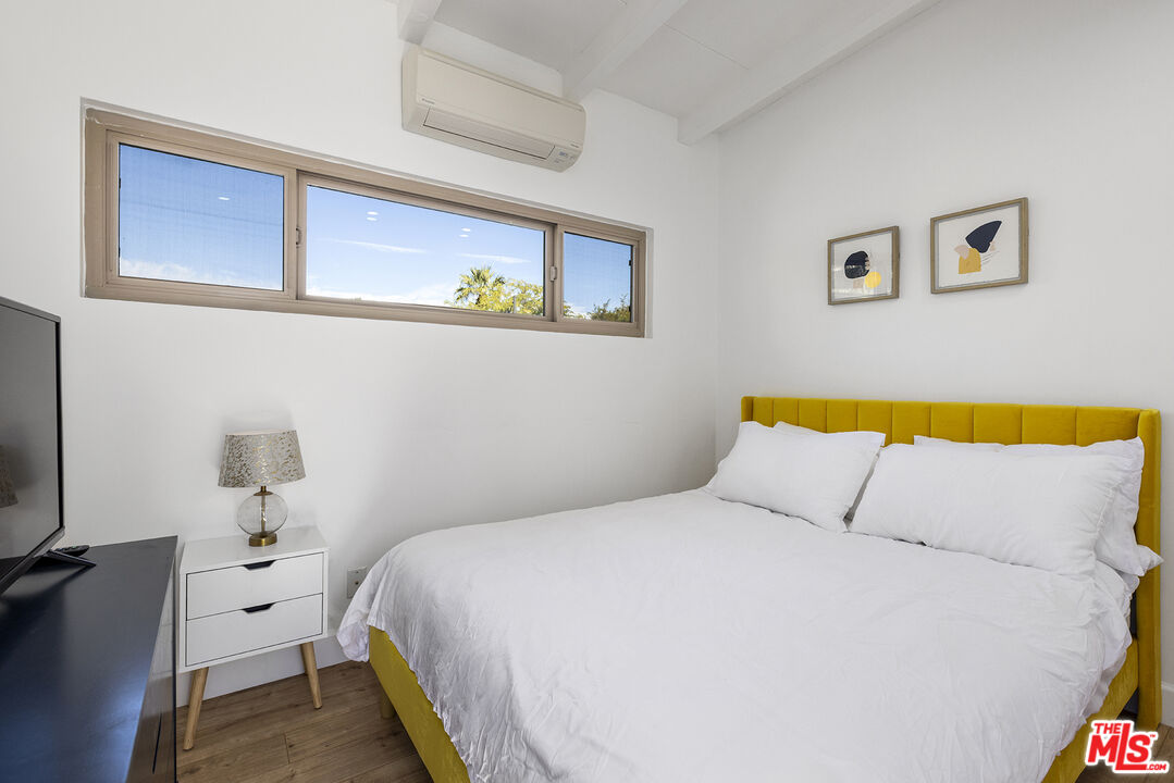 Undisclosed Address Palm Desert, CA 92260 - Photo 18 of 24 a bedroom with a bed and a flat screen tv