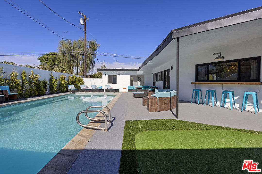 Undisclosed Address Palm Desert, CA 92260 - Photo 21 of 24 a swimming pool view with a seating space