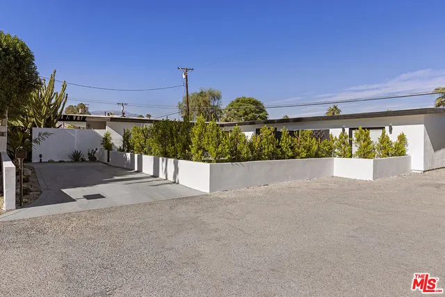 a view of a street with a building in the background