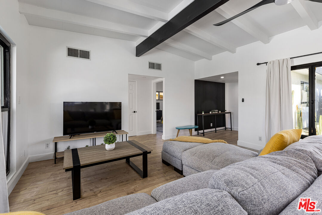 Undisclosed Address Palm Desert, CA 92260 - Photo 4 of 24 a living room with furniture and a flat screen tv