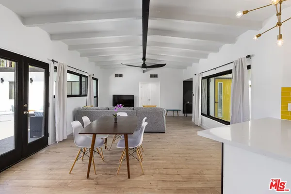 a view of a livingroom with furniture window and wooden floor