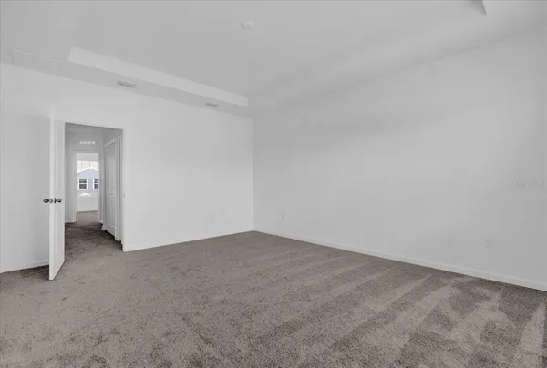 a bathroom with a shower sink and mirror