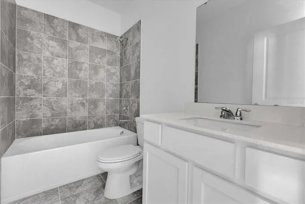 a view of a small space with wooden floor and a window