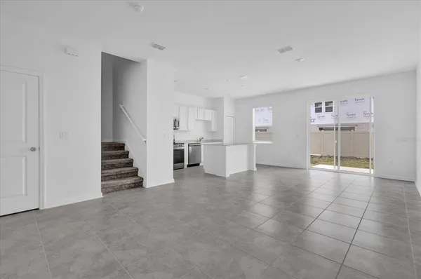 a view of a livingroom with a staircase
