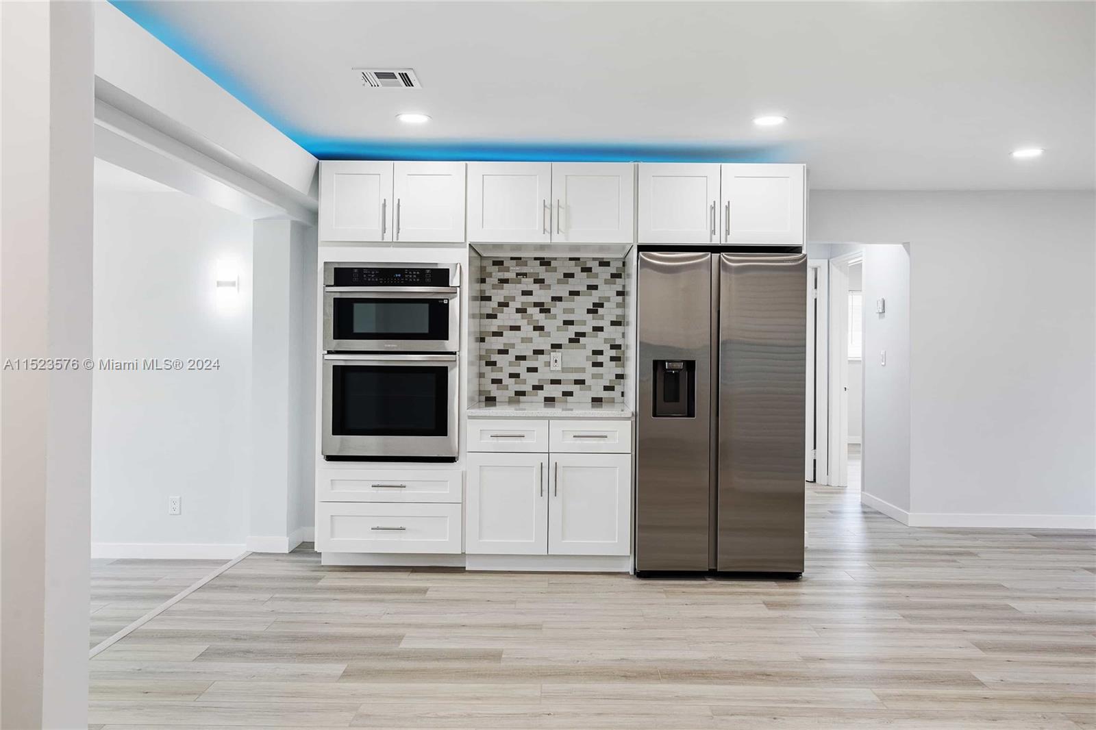 3329 Arthur Street Hollywood, FL 33021 - Photo 6 of 25 a kitchen with stainless steel appliances a refrigerator and a stove top oven