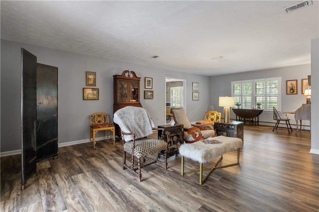 4012 Morris Road Powder Springs, GA 30127 - Photo 19 of 64 a living room with furniture and wooden floor