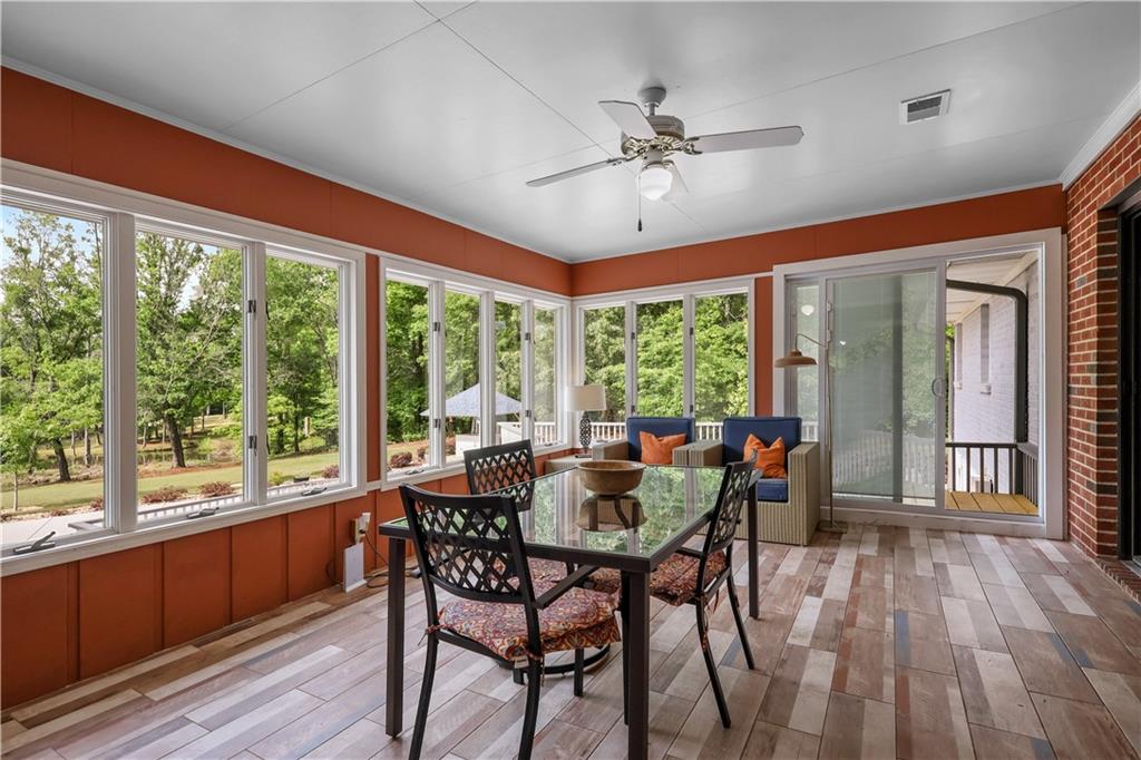 4012 Morris Road Powder Springs, GA 30127 - Photo 21 of 64 a view of a dining room with furniture window and wooden floor
