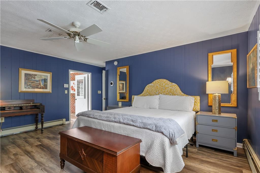 4012 Morris Road Powder Springs, GA 30127 - Photo 23 of 64 a bedroom with a bed and dresser with mirror