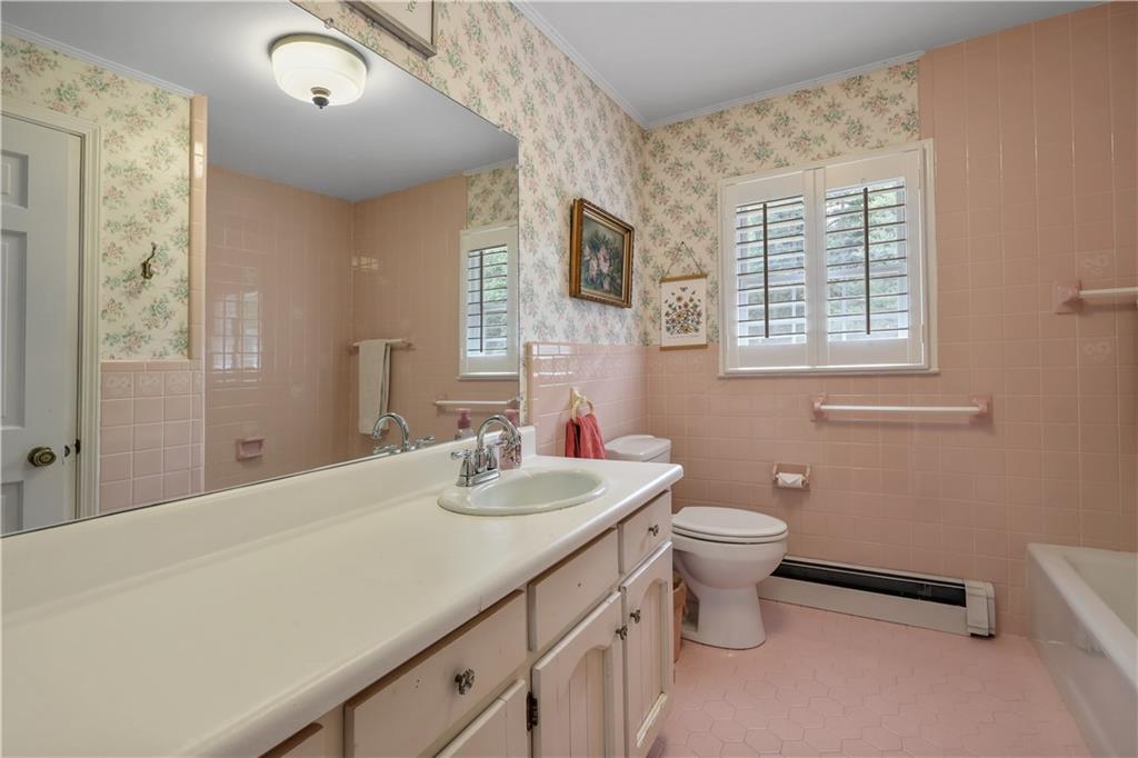 4012 Morris Road Powder Springs, GA 30127 - Photo 28 of 64 a bathroom with a double vanity sink toilet and a mirror