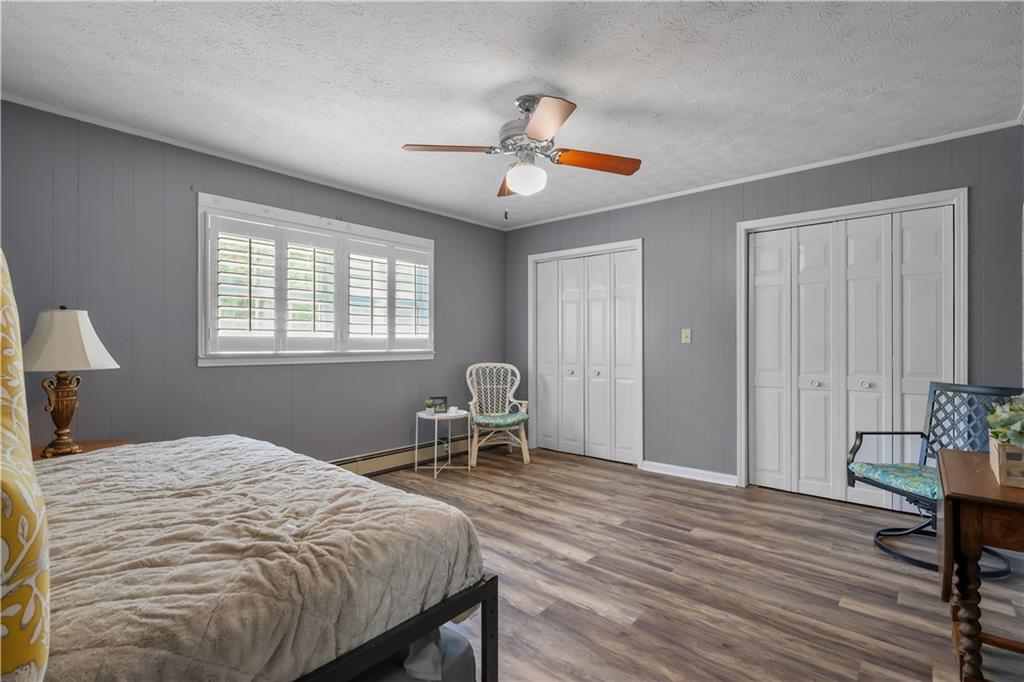 4012 Morris Road Powder Springs, GA 30127 - Photo 29 of 64 a bedroom with a bed table chair and a window