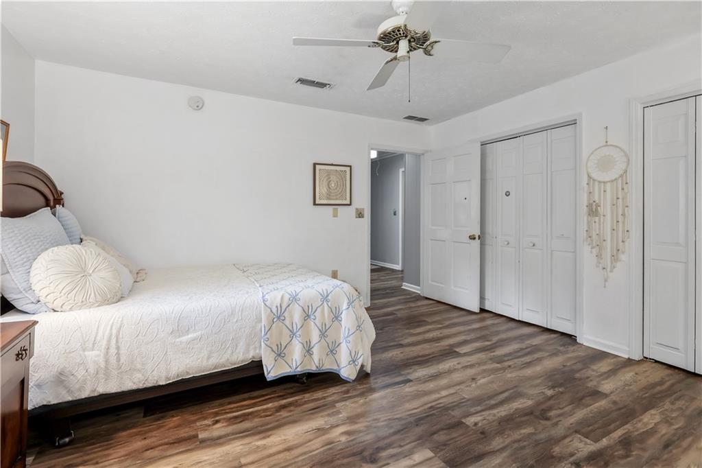 4012 Morris Road Powder Springs, GA 30127 - Photo 32 of 64 a bedroom with a bed and wooden floor