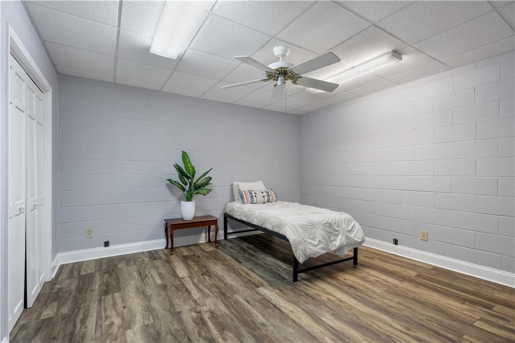 4012 Morris Road Powder Springs, GA 30127 - Photo 35 of 64 a bedroom with a bed and a chandelier