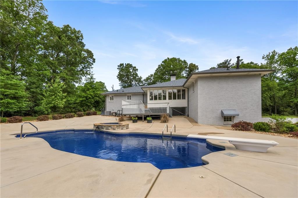4012 Morris Road Powder Springs, GA 30127 - Photo 40 of 64 a swimming pool with outdoor seating and yard