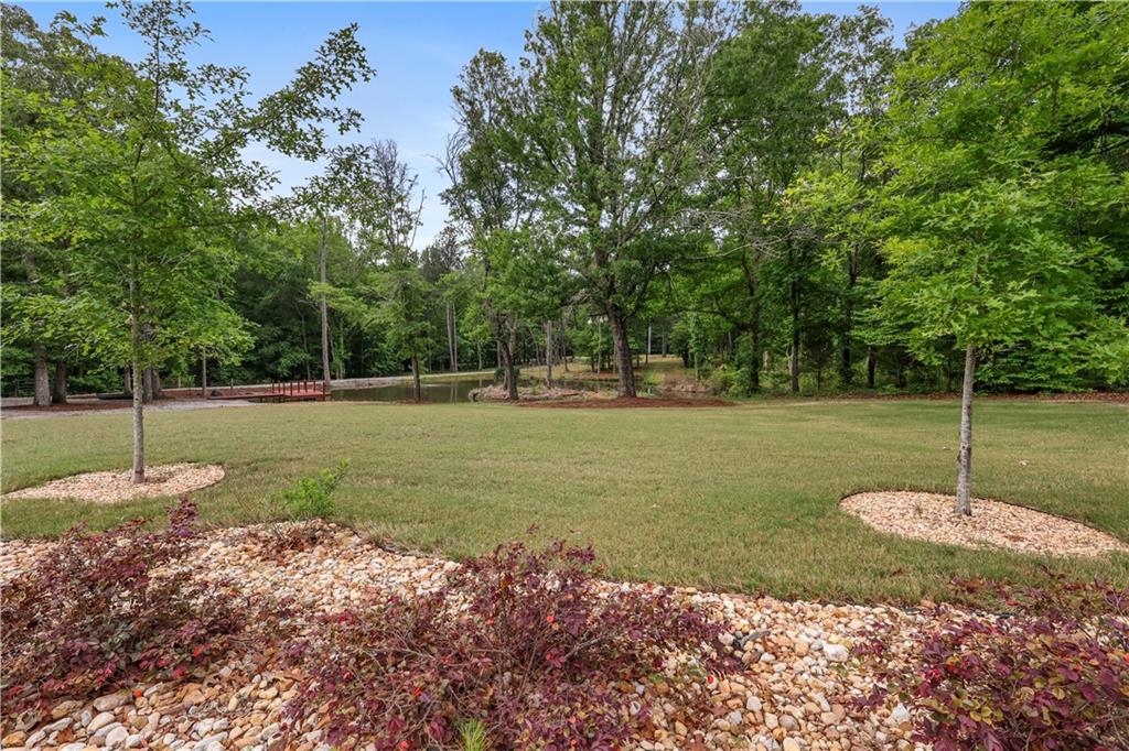4012 Morris Road Powder Springs, GA 30127 - Photo 44 of 64 a backyard of a house with a fountain and entertaining space