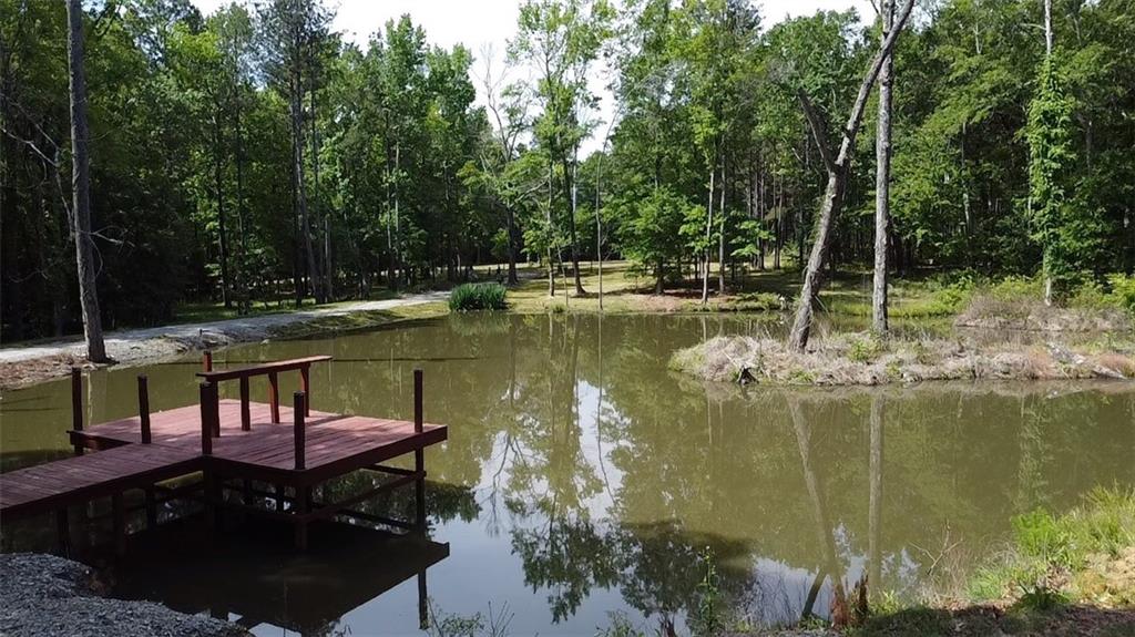 4012 Morris Road Powder Springs, GA 30127 - Photo 55 of 64 a view of swimming pool with a table and chairs