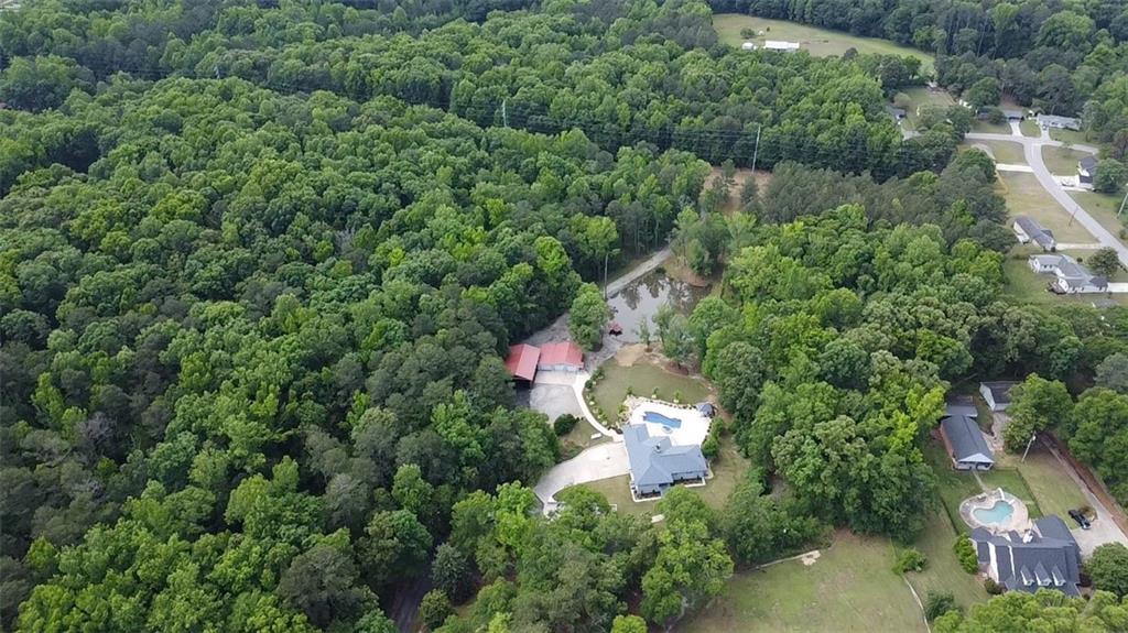 4012 Morris Road Powder Springs, GA 30127 - Photo 61 of 64 an aerial view of residential house with outdoor space and trees all around