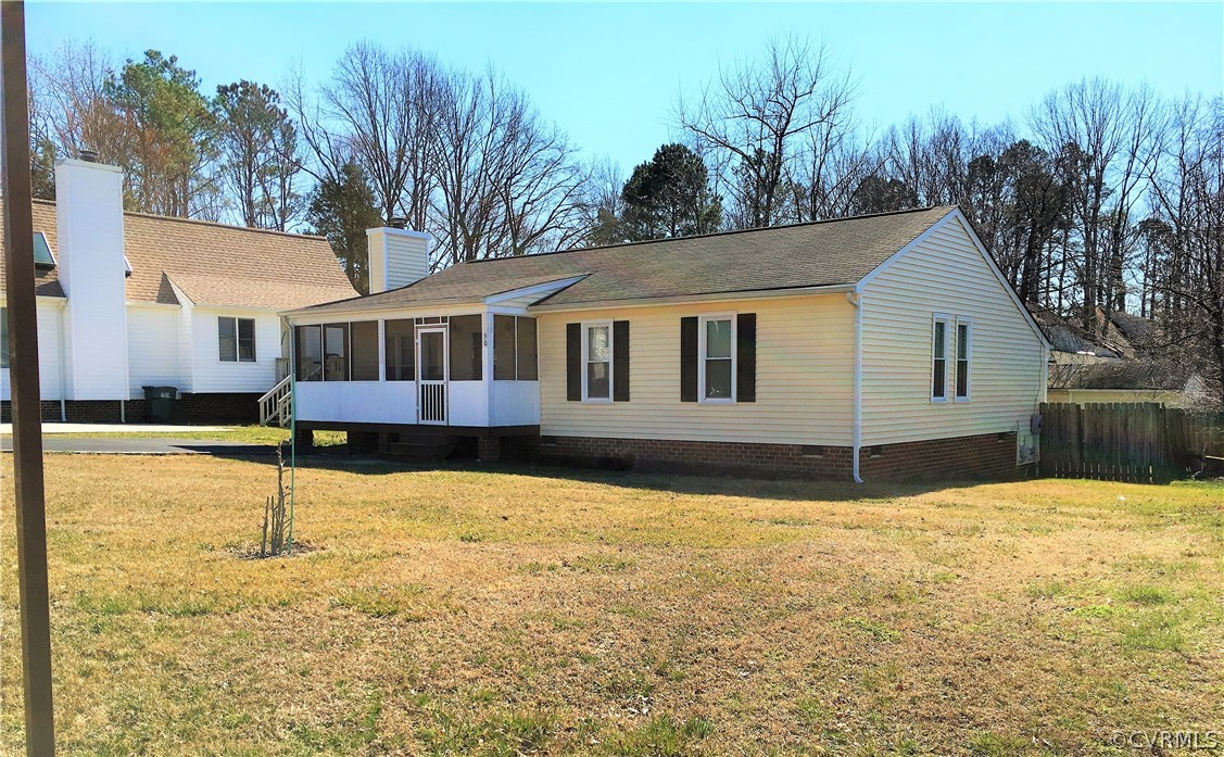 a house that has a tree in front of it