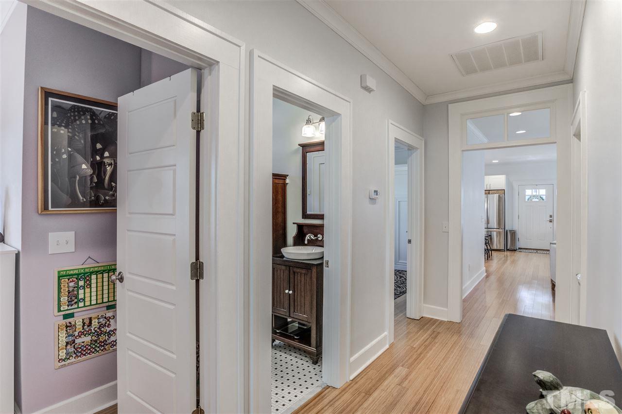 521 Mial Street Raleigh, NC 27608 - Photo 14 of 30 a view of a hallway with wooden floor and windows