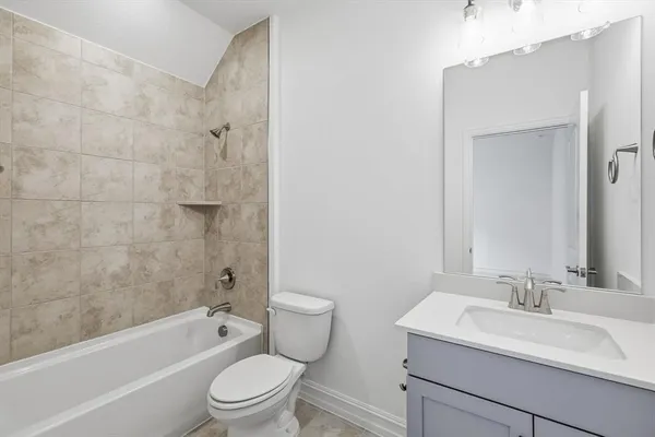 a bathroom with a sink toilet a bathtub and a vanity
