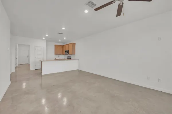 a view of a kitchen with white cabinets