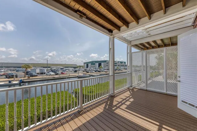 a view of balcony with wooden floor
