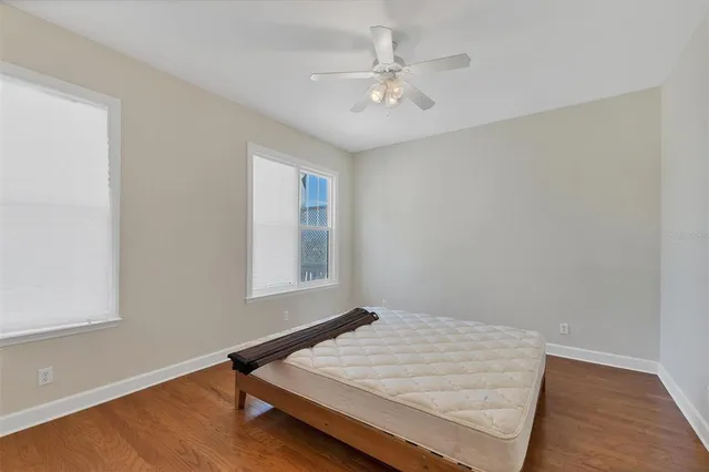 a room with a bed and a window