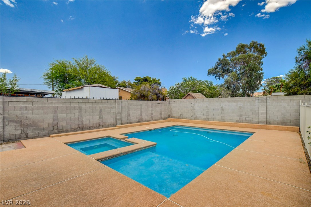 1810 Pinto Road Henderson, NV 89002 - Photo 47 of 53 Cool off and relax in the sparkling backyard swimming pool and adjacent spa.