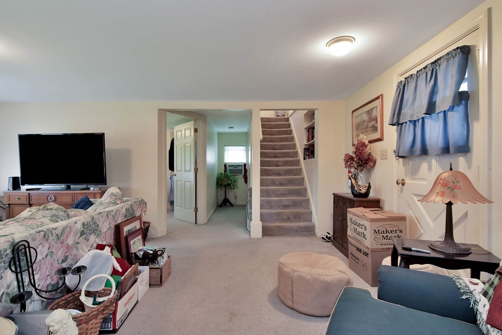 438 Boston Post Road Amherst, NH 03031 - Photo 11 of 32 a bedroom with furniture and a flat screen tv