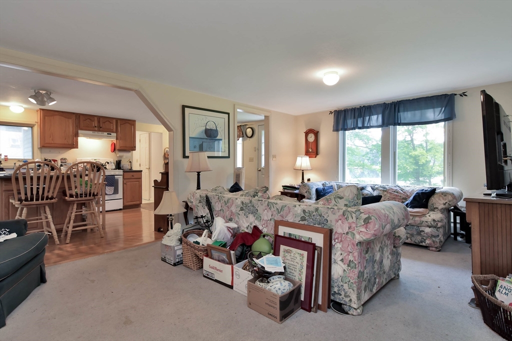 438 Boston Post Road Amherst, NH 03031 - Photo 13 of 32 a living room with furniture and a large window