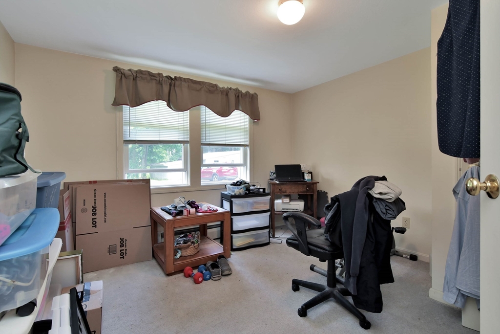 438 Boston Post Road Amherst, NH 03031 - Photo 19 of 32 a view of a workspace with furniture and a window