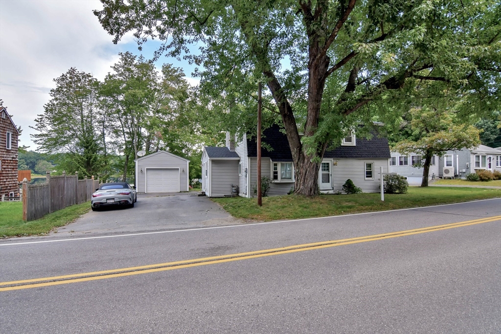 438 Boston Post Road Amherst, NH 03031 - Photo 2 of 32 a view of a house with a patio and a yard