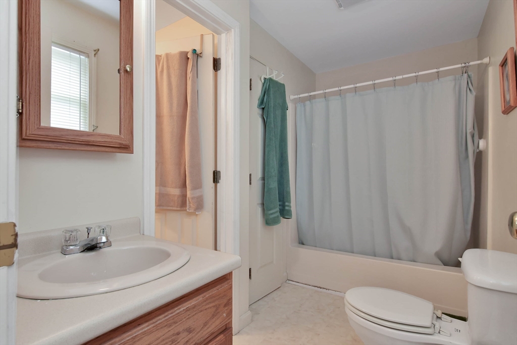 438 Boston Post Road Amherst, NH 03031 - Photo 24 of 32 a bathroom with a sink a toilet and shower
