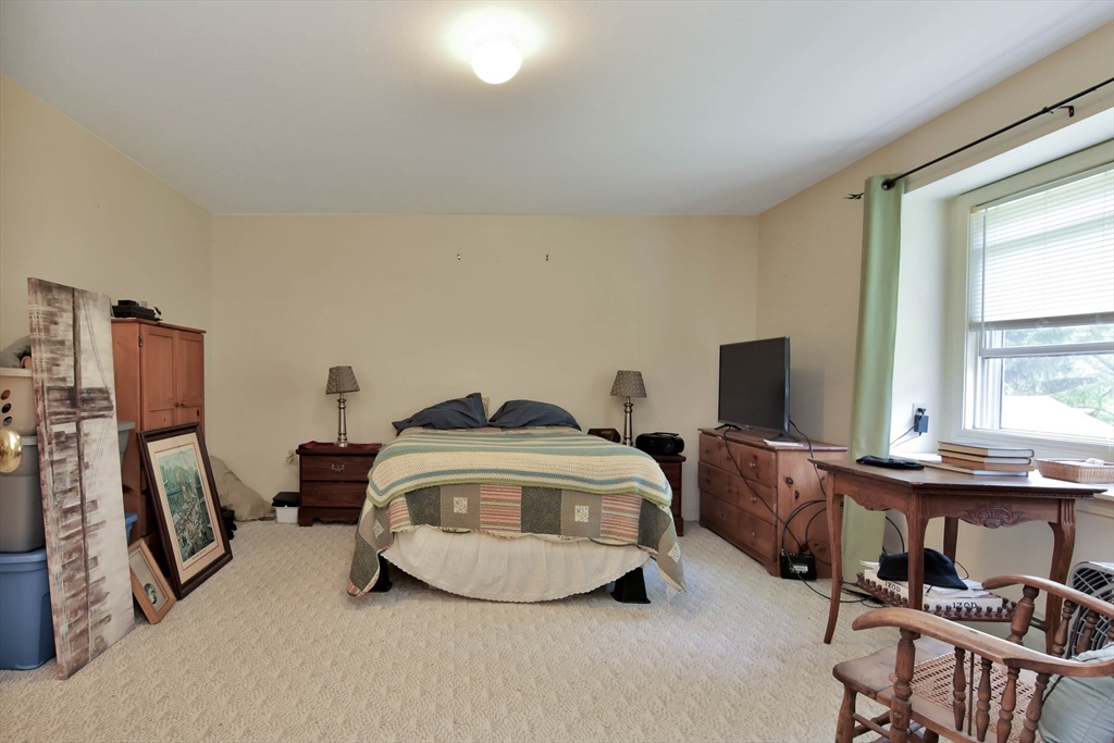 438 Boston Post Road Amherst, NH 03031 - Photo 28 of 32 a bedroom with bed and a window