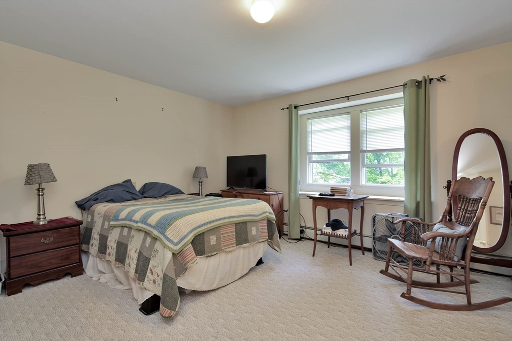438 Boston Post Road Amherst, NH 03031 - Photo 29 of 32 a bedroom with bed and a large window