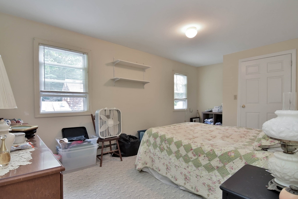 438 Boston Post Road Amherst, NH 03031 - Photo 30 of 32 a bedroom with a bed and a window