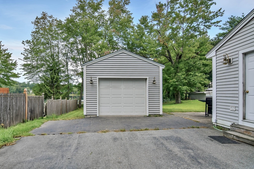 438 Boston Post Road Amherst, NH 03031 - Photo 5 of 32 a front view of a house with a garage