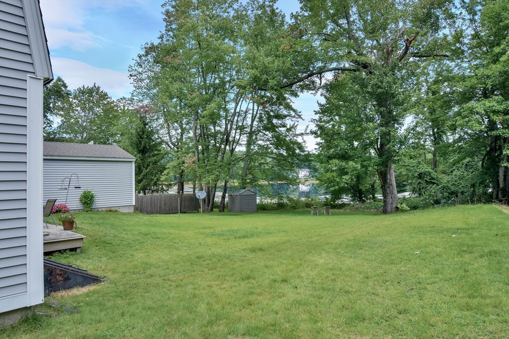 438 Boston Post Road Amherst, NH 03031 - Photo 6 of 32 a view of a trees in a yard