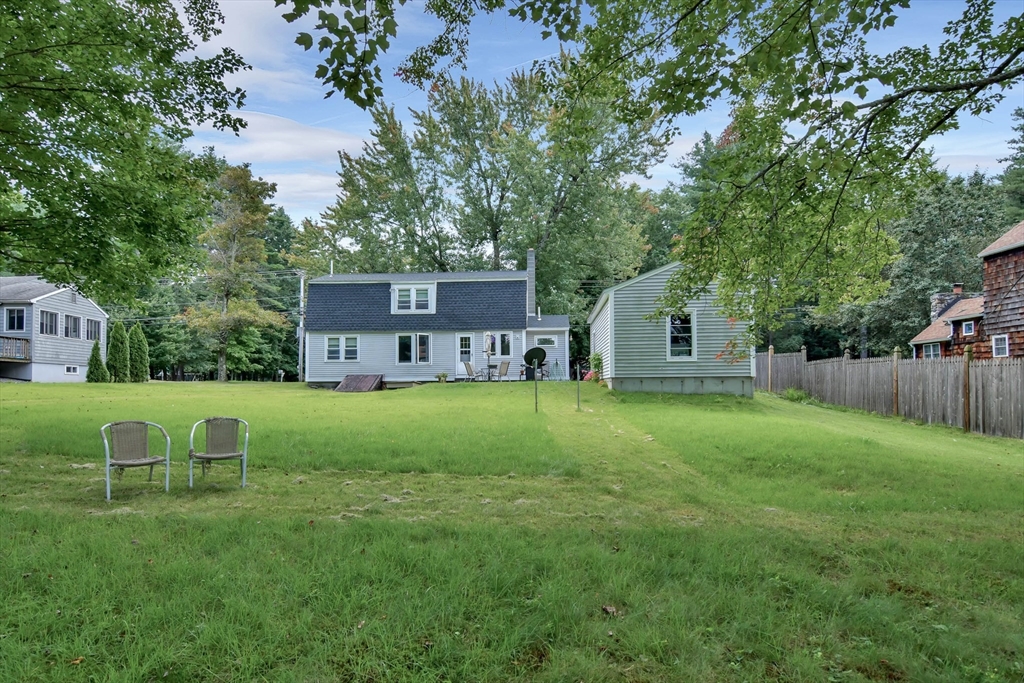438 Boston Post Road Amherst, NH 03031 - Photo 7 of 32 a view of a house with backyard and a tree
