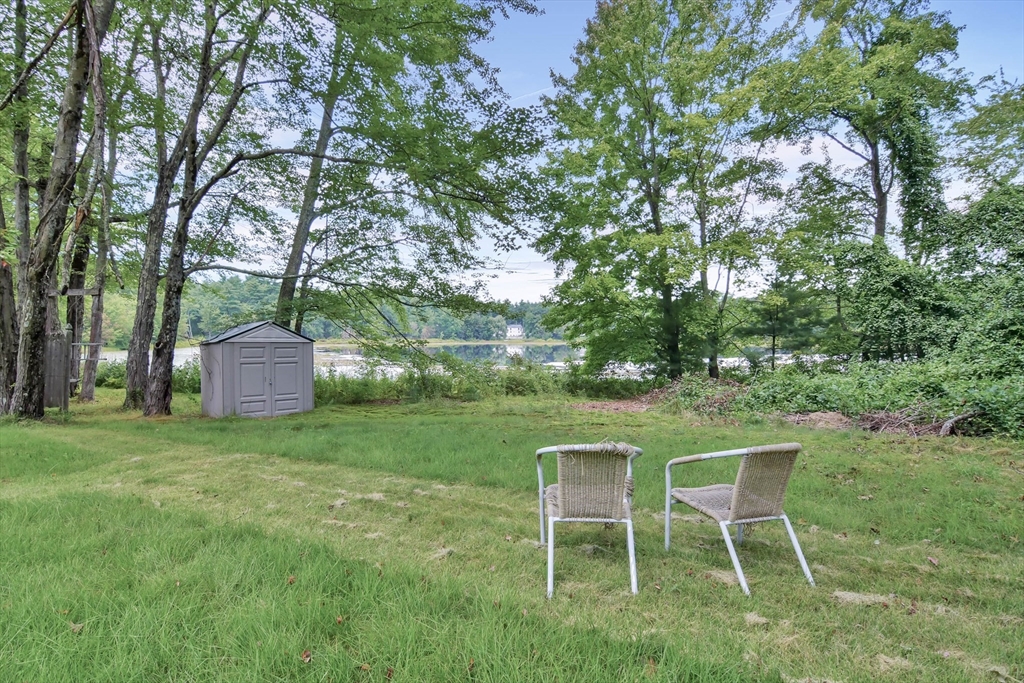 438 Boston Post Road Amherst, NH 03031 - Photo 8 of 32 a couple of table and chair in the grass
