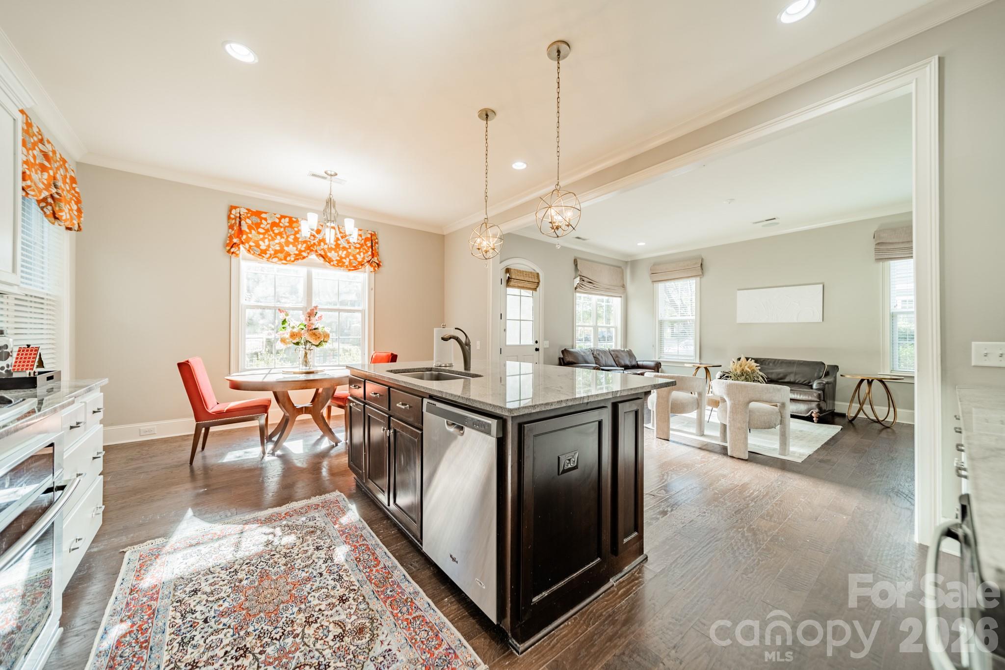 131 Boyce Road Charlotte, NC 28211 - Photo 12 of 48 a very nice looking dining room with a large window and a chandelier