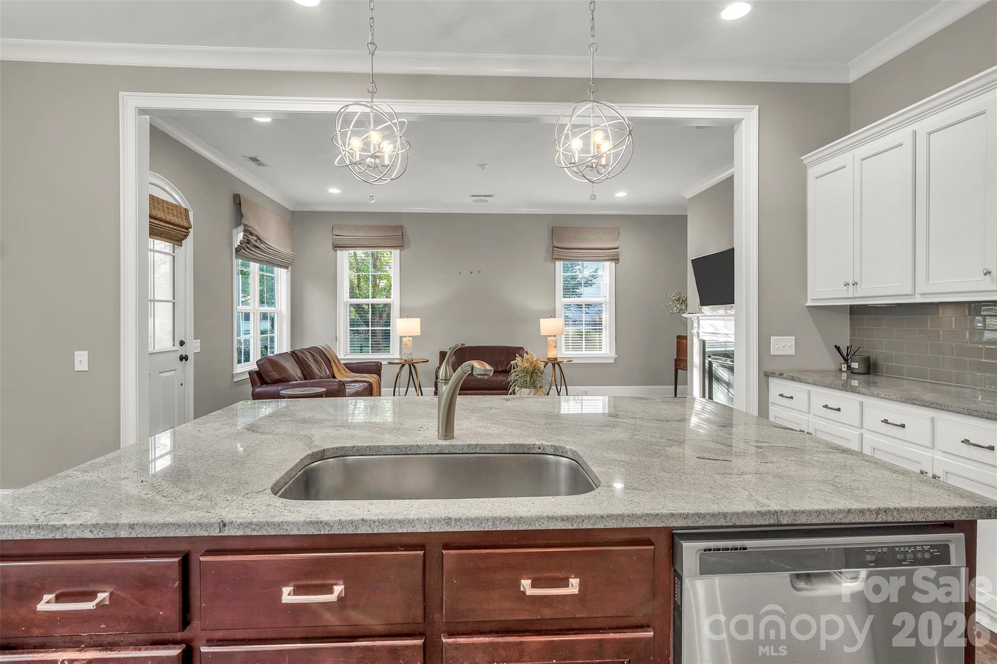 131 Boyce Road Charlotte, NC 28211 - Photo 15 of 48 a view of a kitchen with granite countertop a sink and chandelier