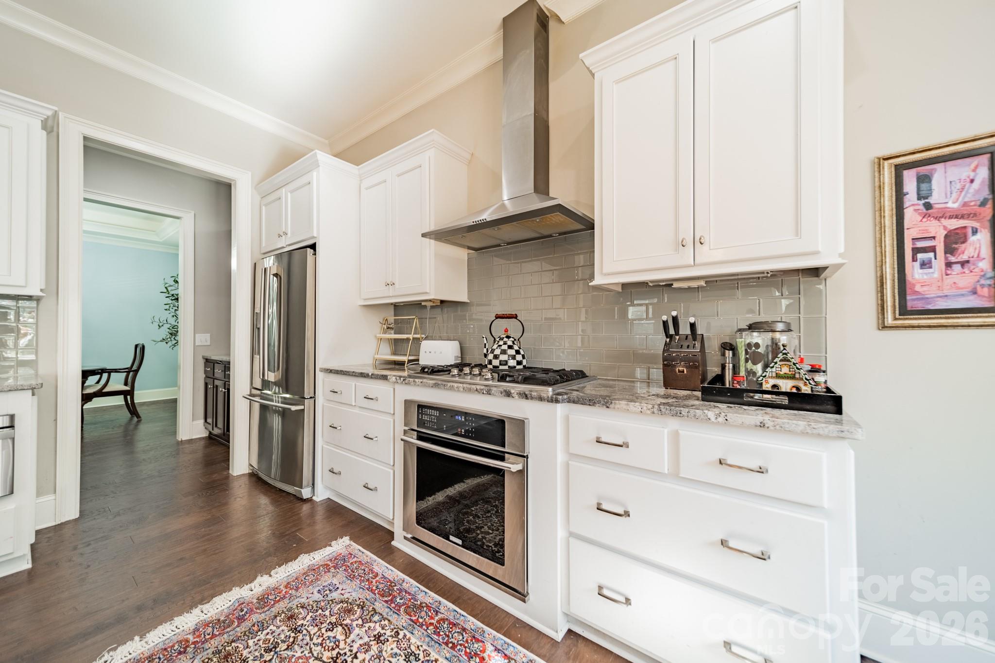131 Boyce Road Charlotte, NC 28211 - Photo 16 of 48 a kitchen with stainless steel appliances granite countertop a stove and a refrigerator