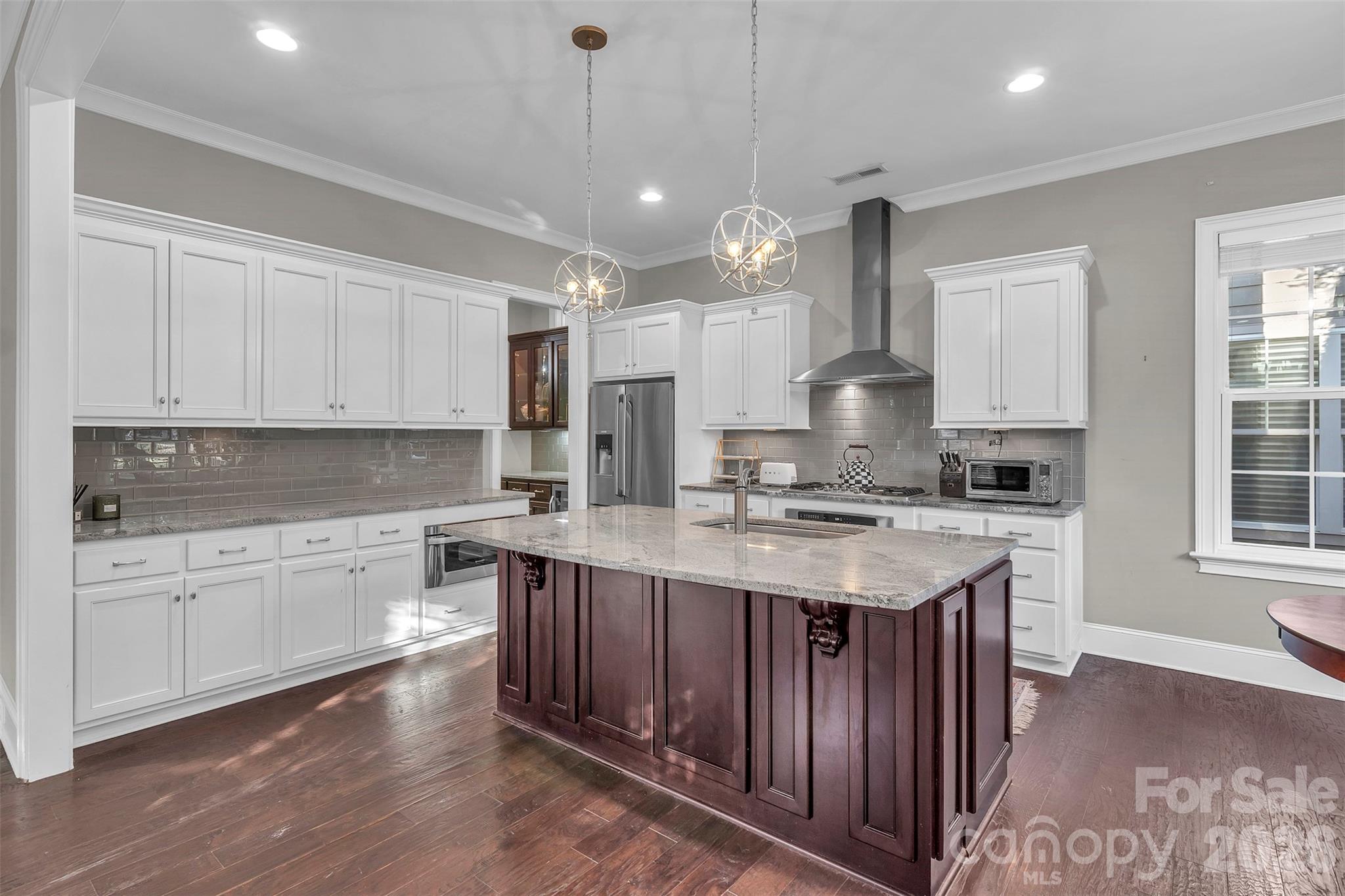 131 Boyce Road Charlotte, NC 28211 - Photo 19 of 48 a kitchen with a stove cabinets and wooden floor