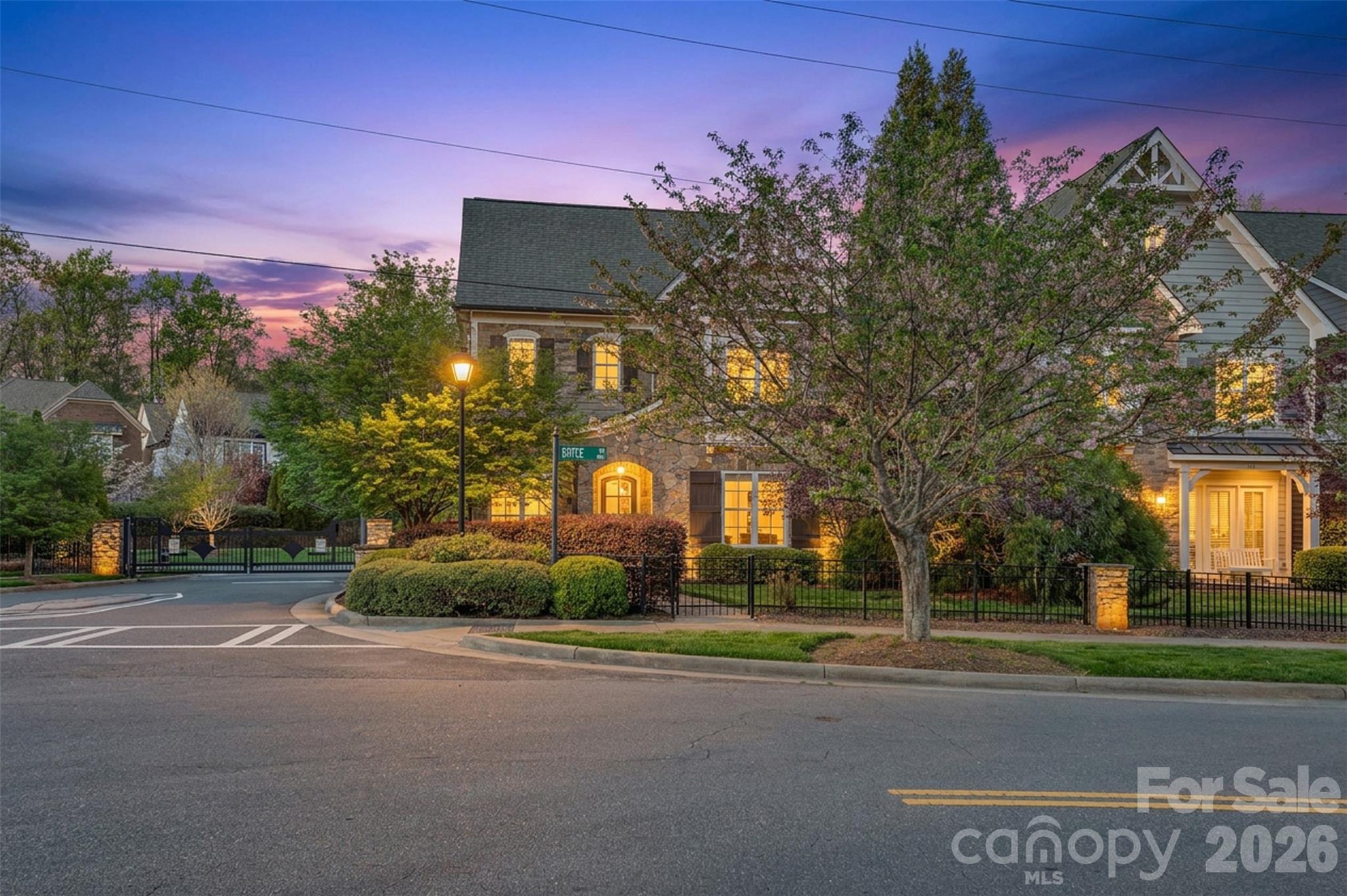 131 Boyce Road Charlotte, NC 28211 - Photo 2 of 48 a front view of a house with a yard and a garage
