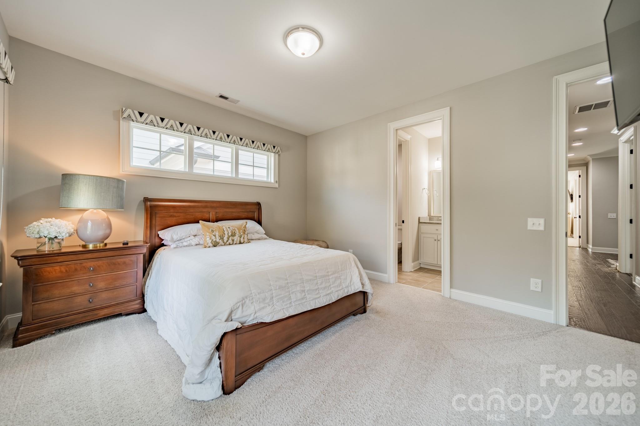 131 Boyce Road Charlotte, NC 28211 - Photo 32 of 48 a bedroom with a bed and lamp