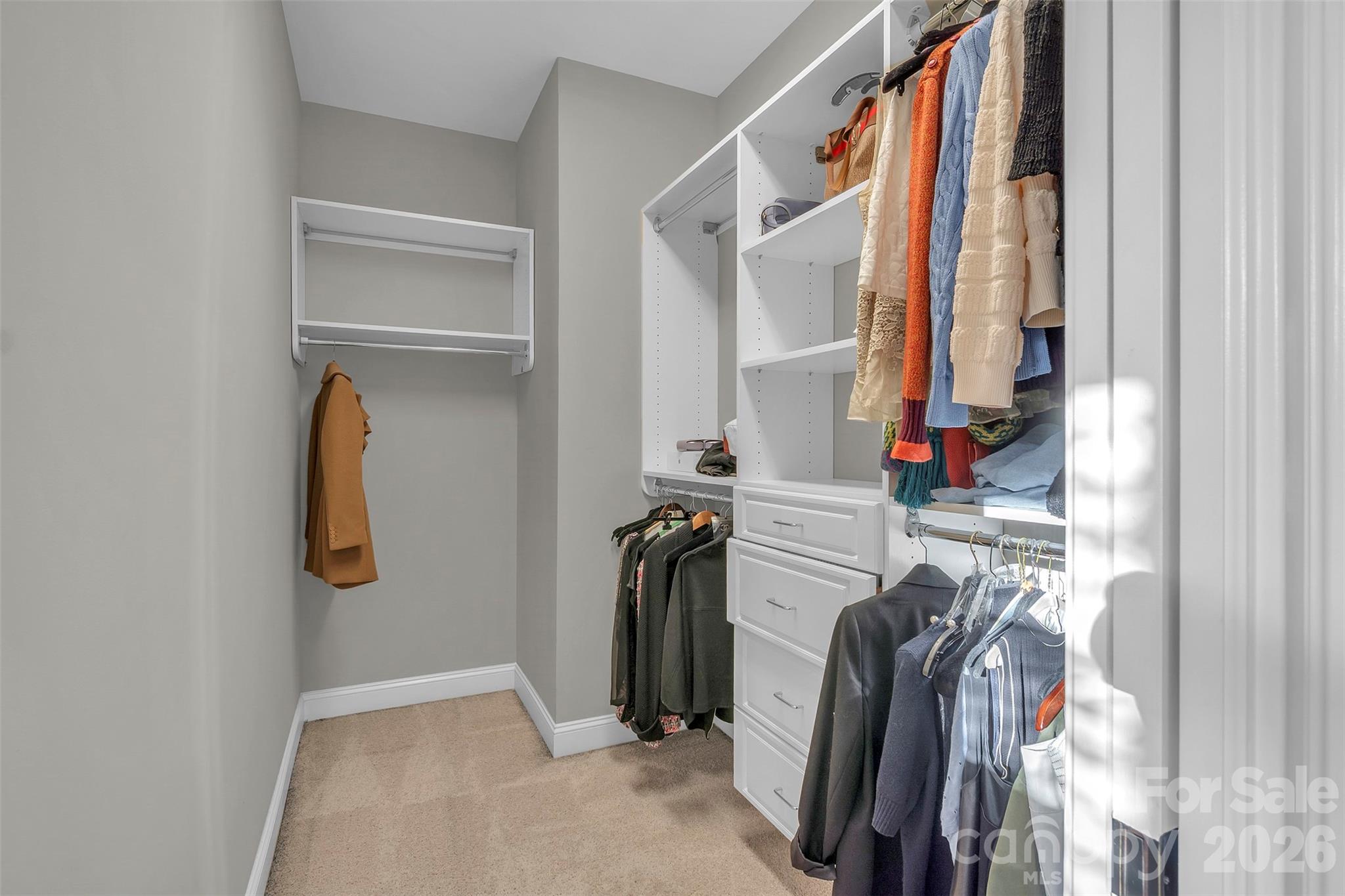 131 Boyce Road Charlotte, NC 28211 - Photo 42 of 48 a view of walk in closet with clothes and shoes