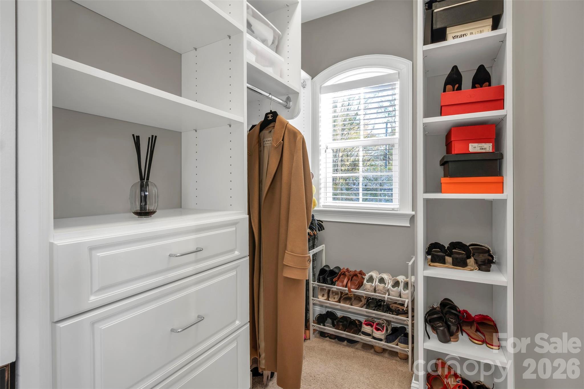131 Boyce Road Charlotte, NC 28211 - Photo 43 of 48 a view of walk in closet with clothes and shoes